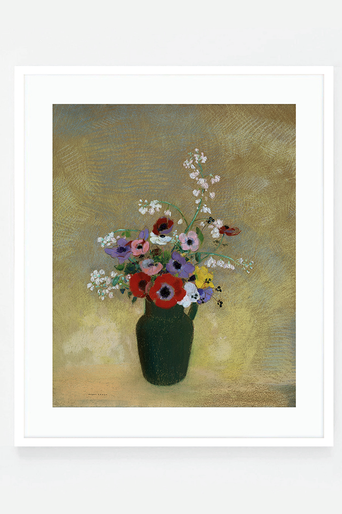 Large green vase with mixed flowers