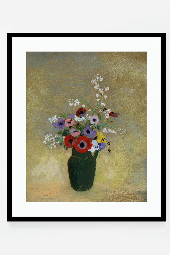 Large green vase with mixed flowers