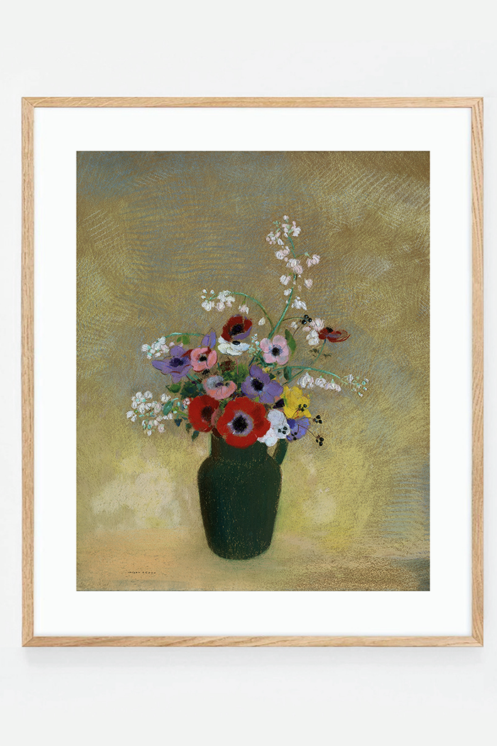 Large green vase with mixed flowers