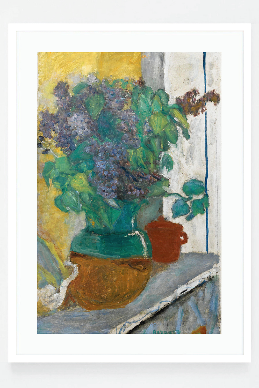 Purple lilac in a yellow and green earthen vase